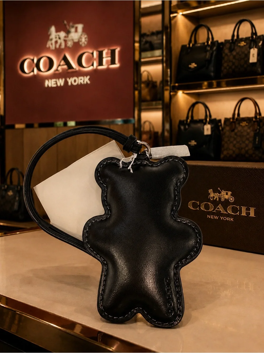 COACH Black Leather Bear Charm Wristlet with dust bag.